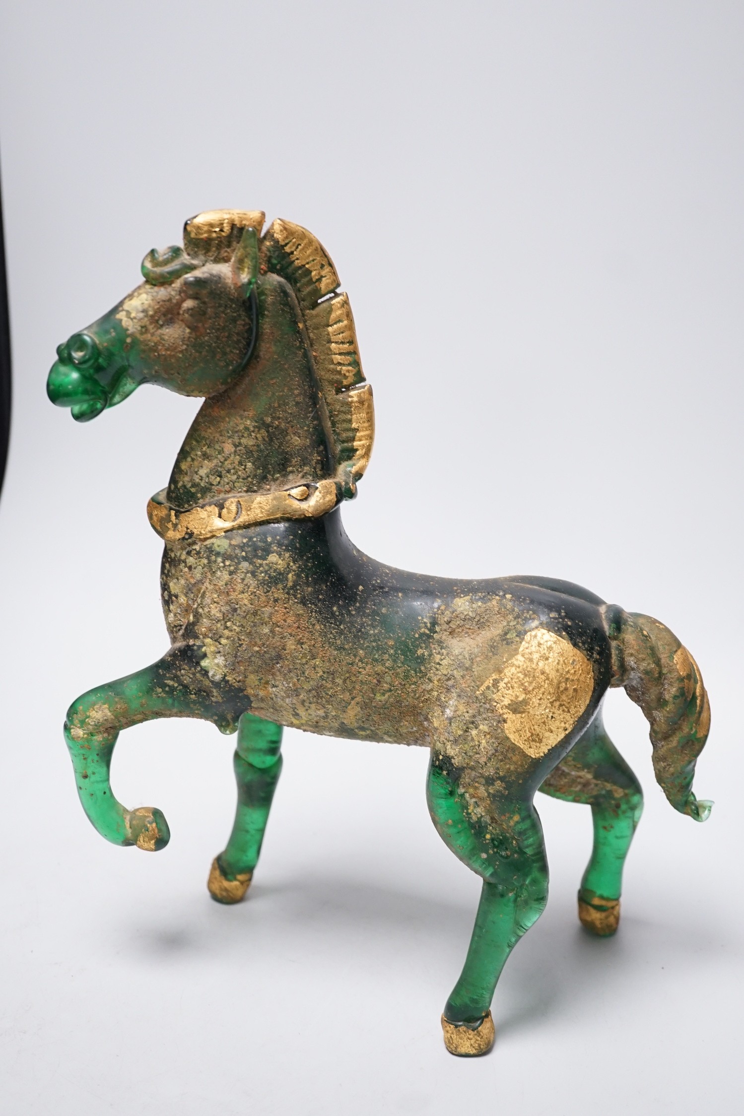 A Murano gilded glass model of the Lion of Venice, 21 cm long and a gilded green glass figure of a horse, 31cm